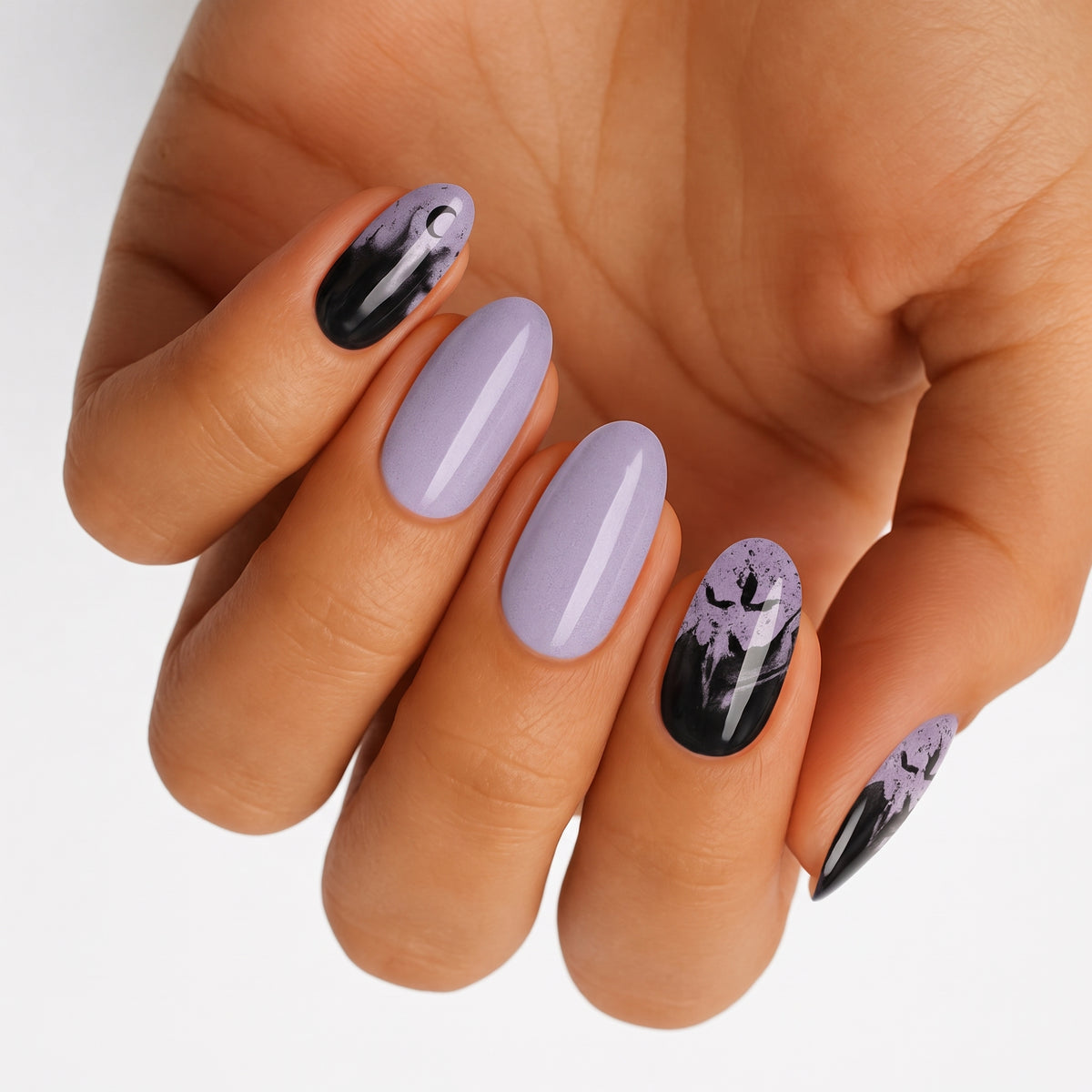 Lilac and black nail wraps with bat silhouettes and speckled Halloween-inspired design, glossy finish.