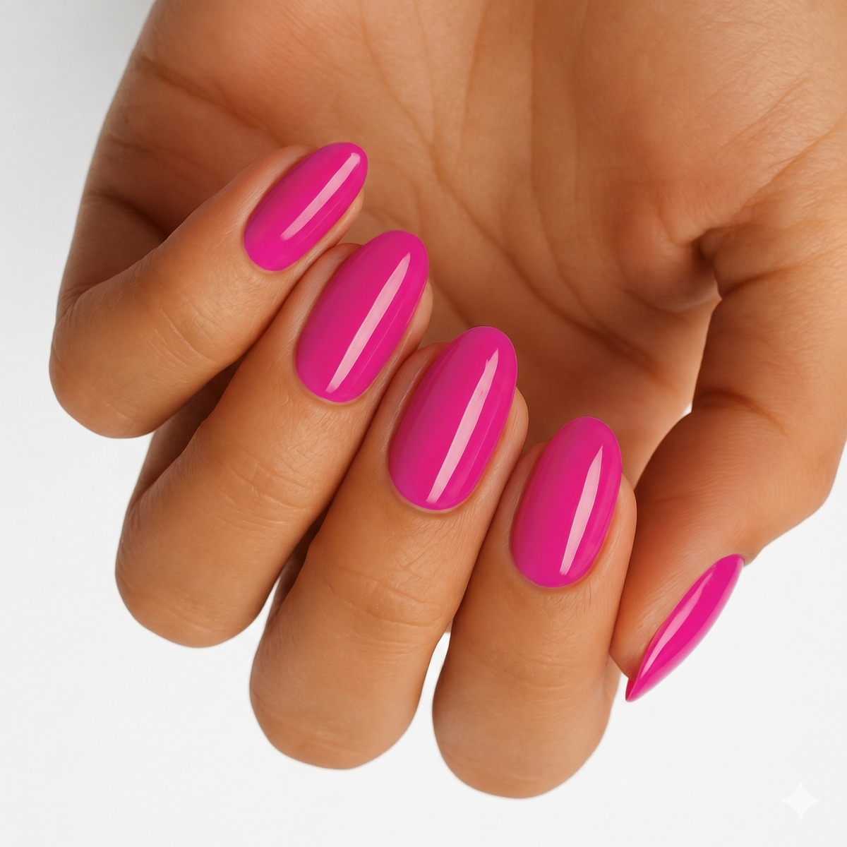 Glossy magenta pink nail wraps in a solid jelly-finish on almond-shaped nails