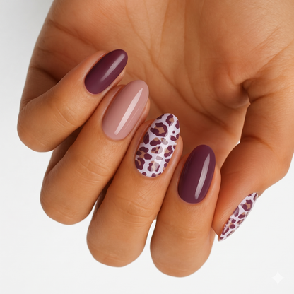 Glossy nail wraps in plum, dusty pink, and leopard print on an oval set