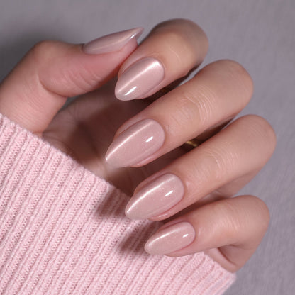 Sheer nude pink almond press-on nails with soft shimmer, glossy finish