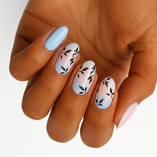 Nail wraps in blue-pink gradient with black leaf vine design, glossy finish, wide fit.
