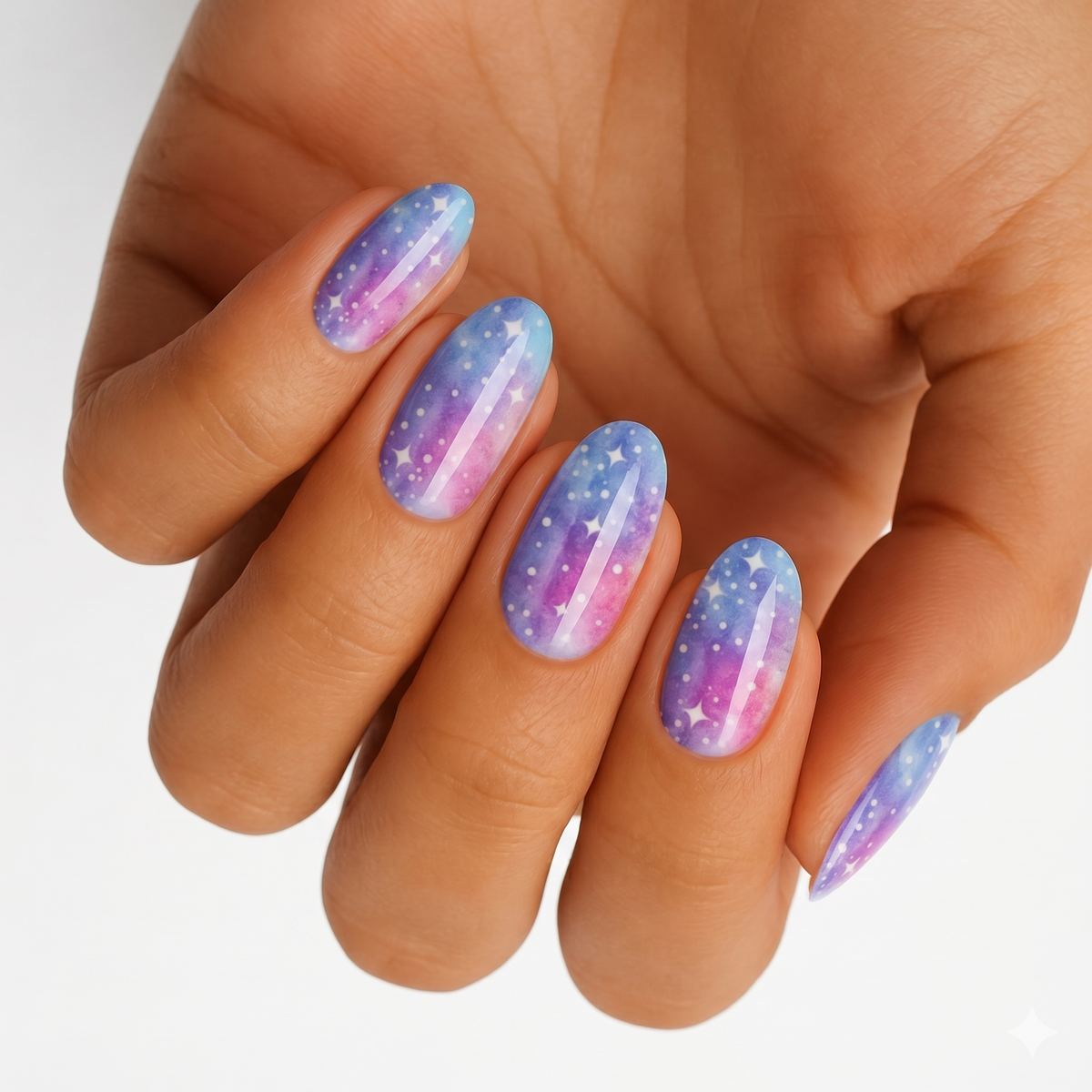 Blue and purple galaxy nail wraps with white stars and sparkle accents