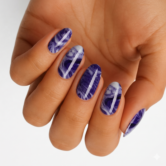 Purple and white marble-effect nail wraps with glossy finish on oval nails