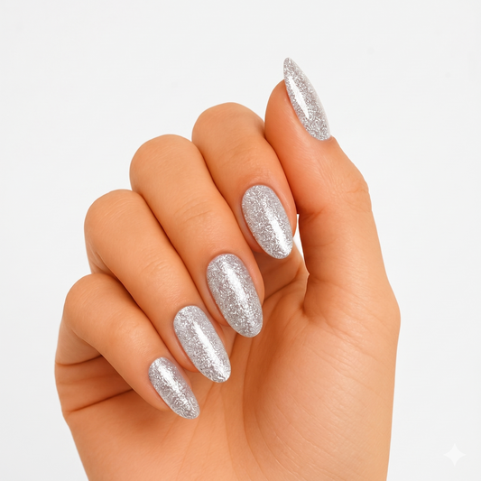 Silver glitter semi-cured gel nail wraps with metallic shimmer on almond-shaped nails.