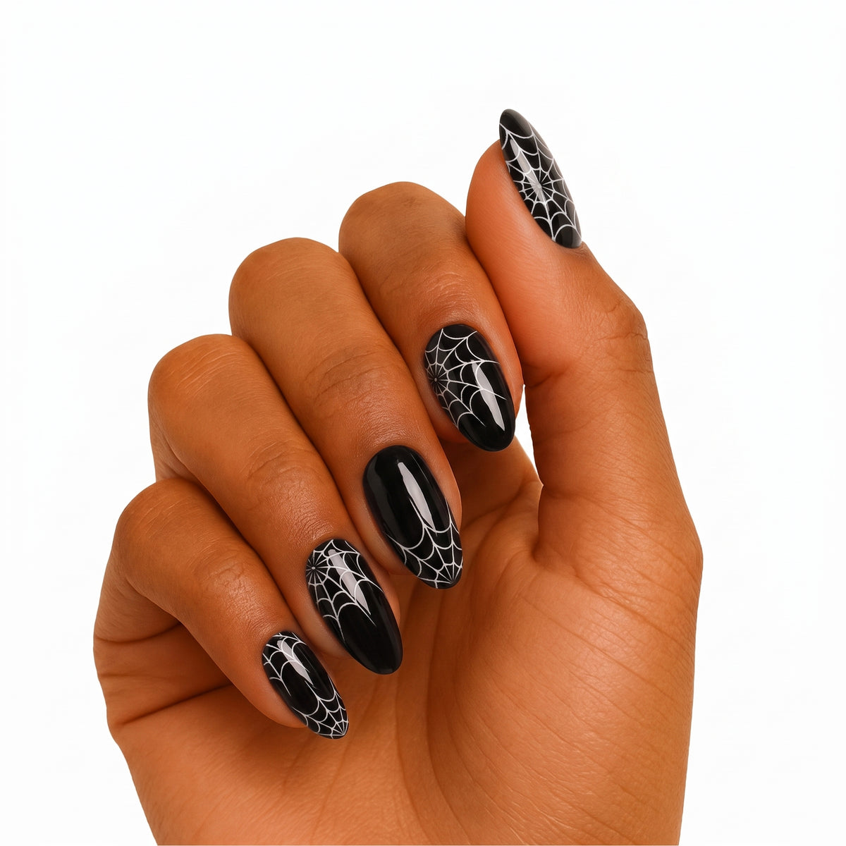 Glossy black semi-cured gel wraps with white spiderweb design on almond-shaped nails.