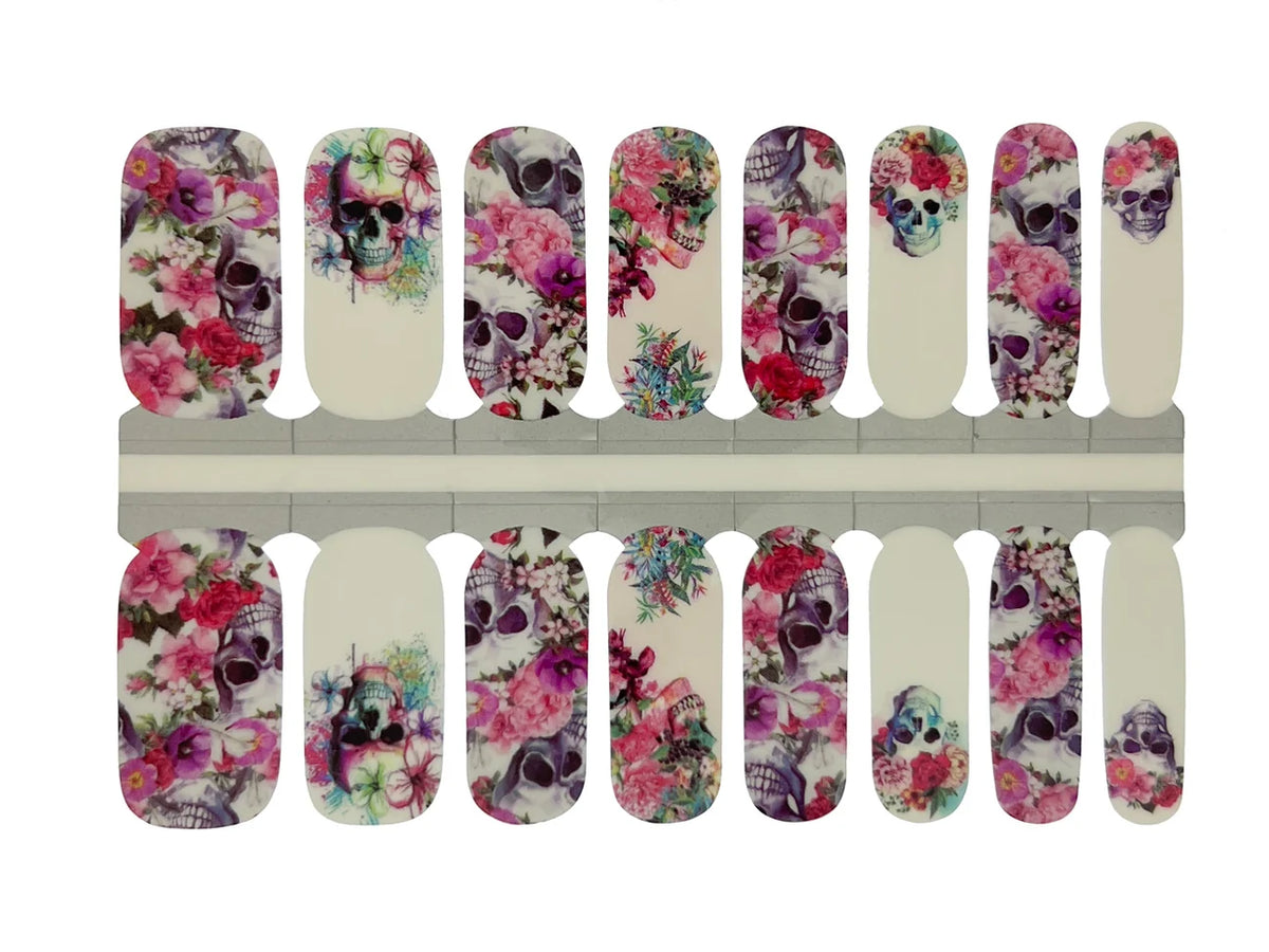Holy Classics nail wraps with floral sugar skull designs in pink, purple and white tones