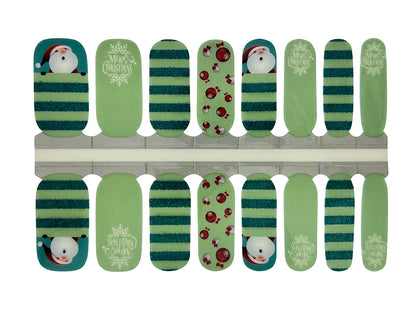 Green nail wraps with teal stripes, Santa, ornaments and "Merry Christmas" text