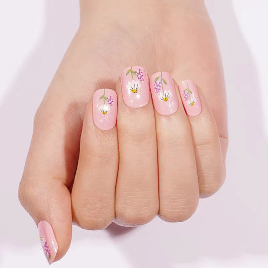 Pink glossy nail wraps with daisy and lavender floral accents