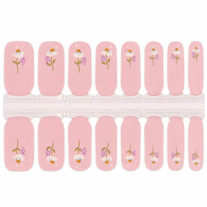 Pink nail wraps with daisy floral print and sparkle accents