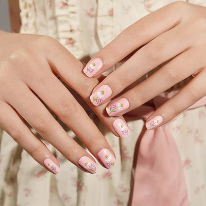 Sheer pink glossy nail wraps with hand-painted daisy and lavender floral accents