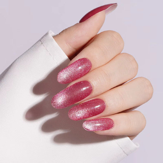 Rose pink shimmer semi-cured gel nail wraps with cat's eye magnetic finish, almond shape