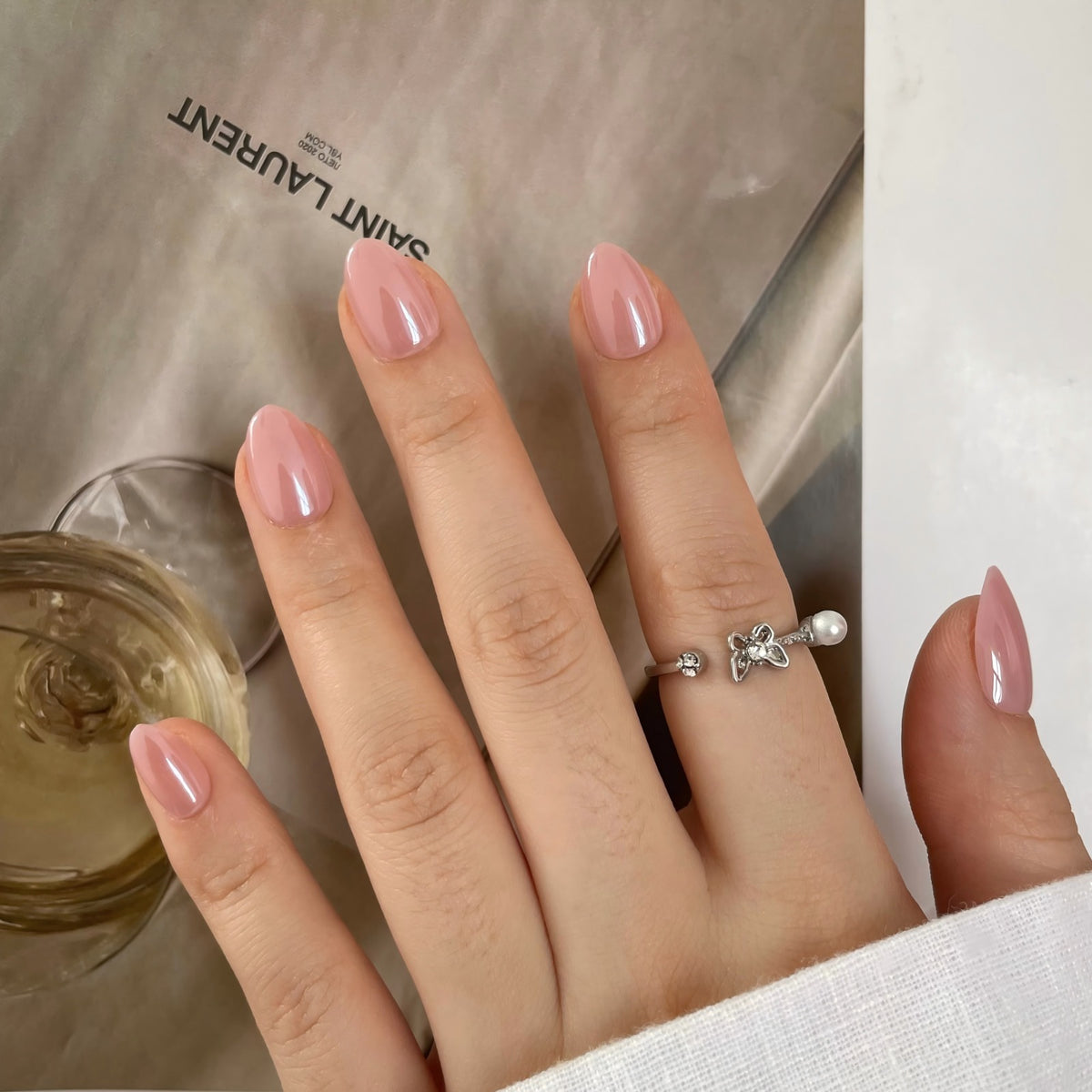 Extra short almond soft gel press-on nails in glossy glazed pink