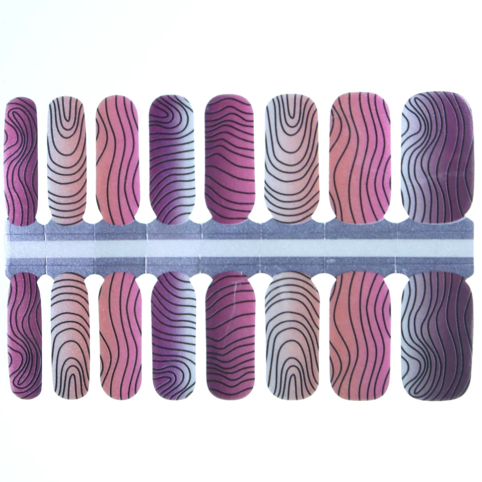Nail wraps in pink-purple ombre with black wavy contour line pattern