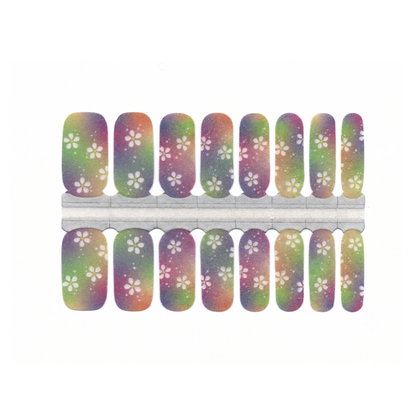 Nail wraps with rainbow galaxy ombré base and white cherry blossom floral print