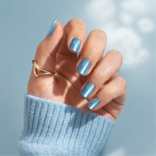 Sky-blue cat's-eye shimmer soft gel press-on nails, extra short natural round shape.