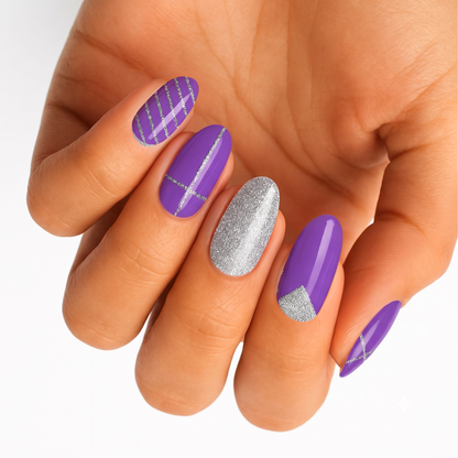 Purple gloss nail wraps with silver glitter stripes and geometric accent tips