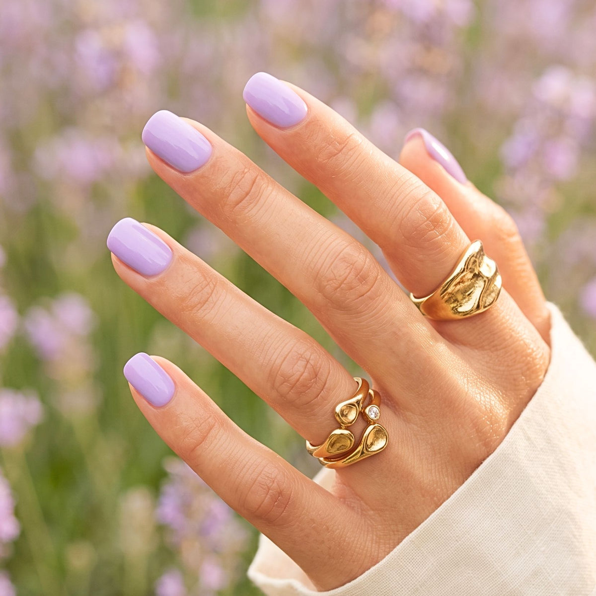 Soft gel press-on nails in glossy solid lavender purple, short round shape