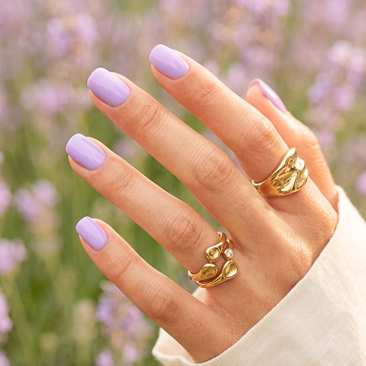 Soft gel press-on nails in glossy solid lavender purple, short round shape