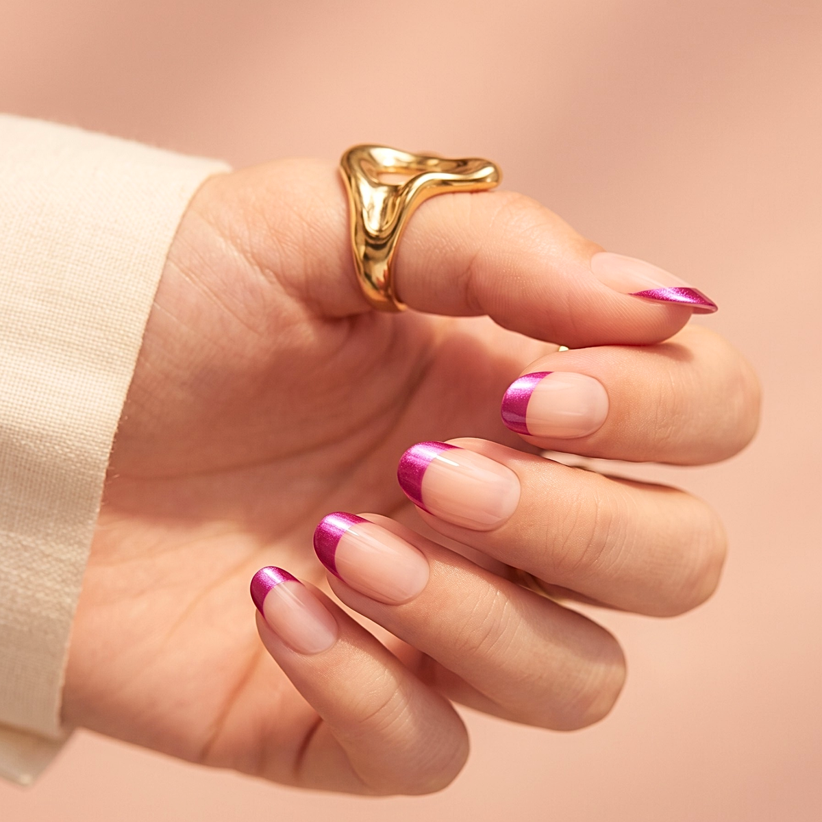 Nude short oval soft gel press-ons with metallic magenta French tip