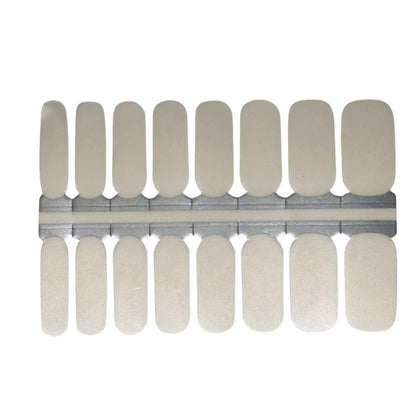 Sheet of Holy Classics non-UV nail wraps in sheer pearl white with subtle shimmer finish
