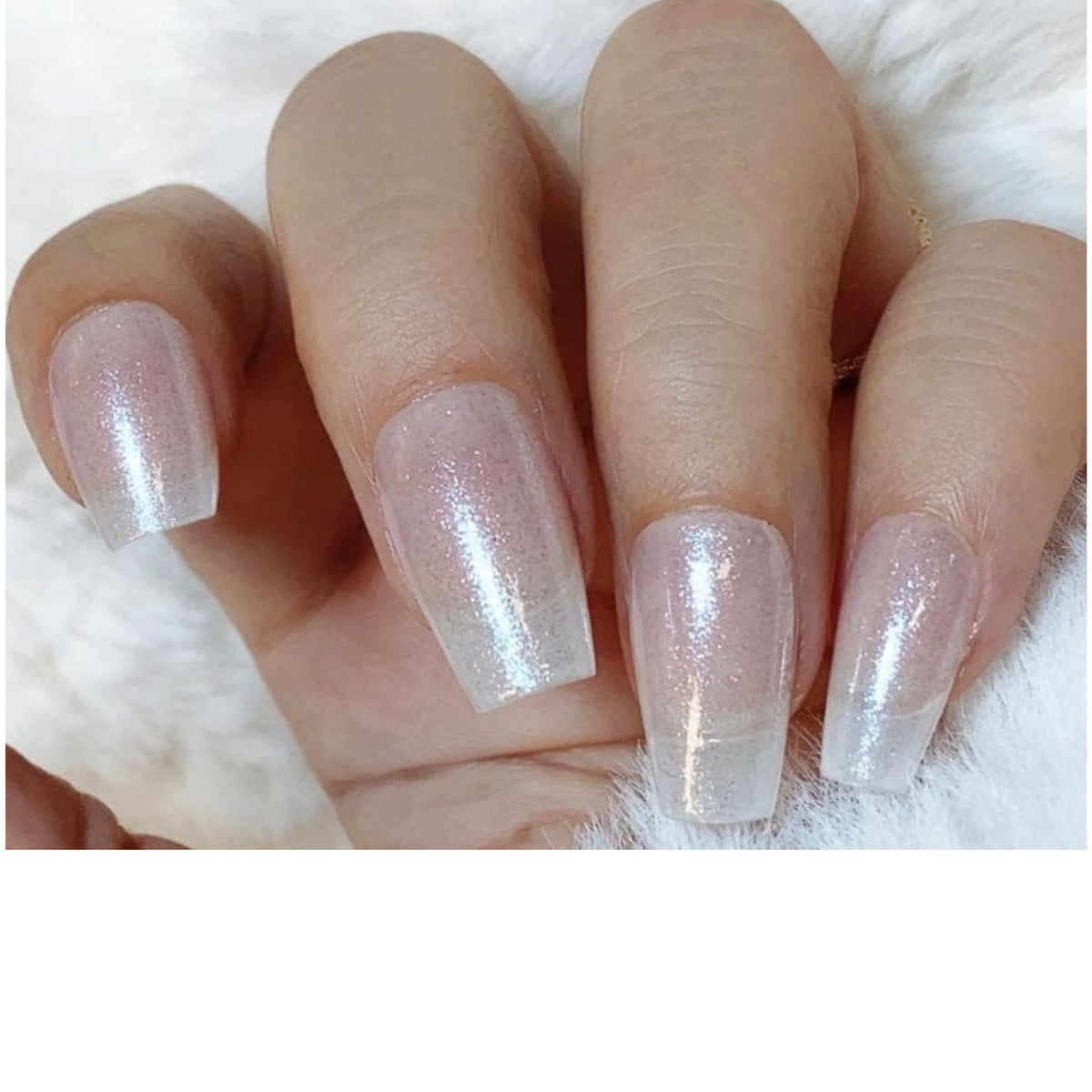 Sheer pearlescent nail wraps with iridescent shimmer on coffin-shaped nails