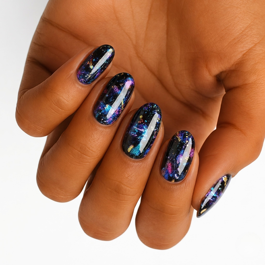 Black glossy nail wraps with multicoloured galaxy-style glitter flecks and foil shards
