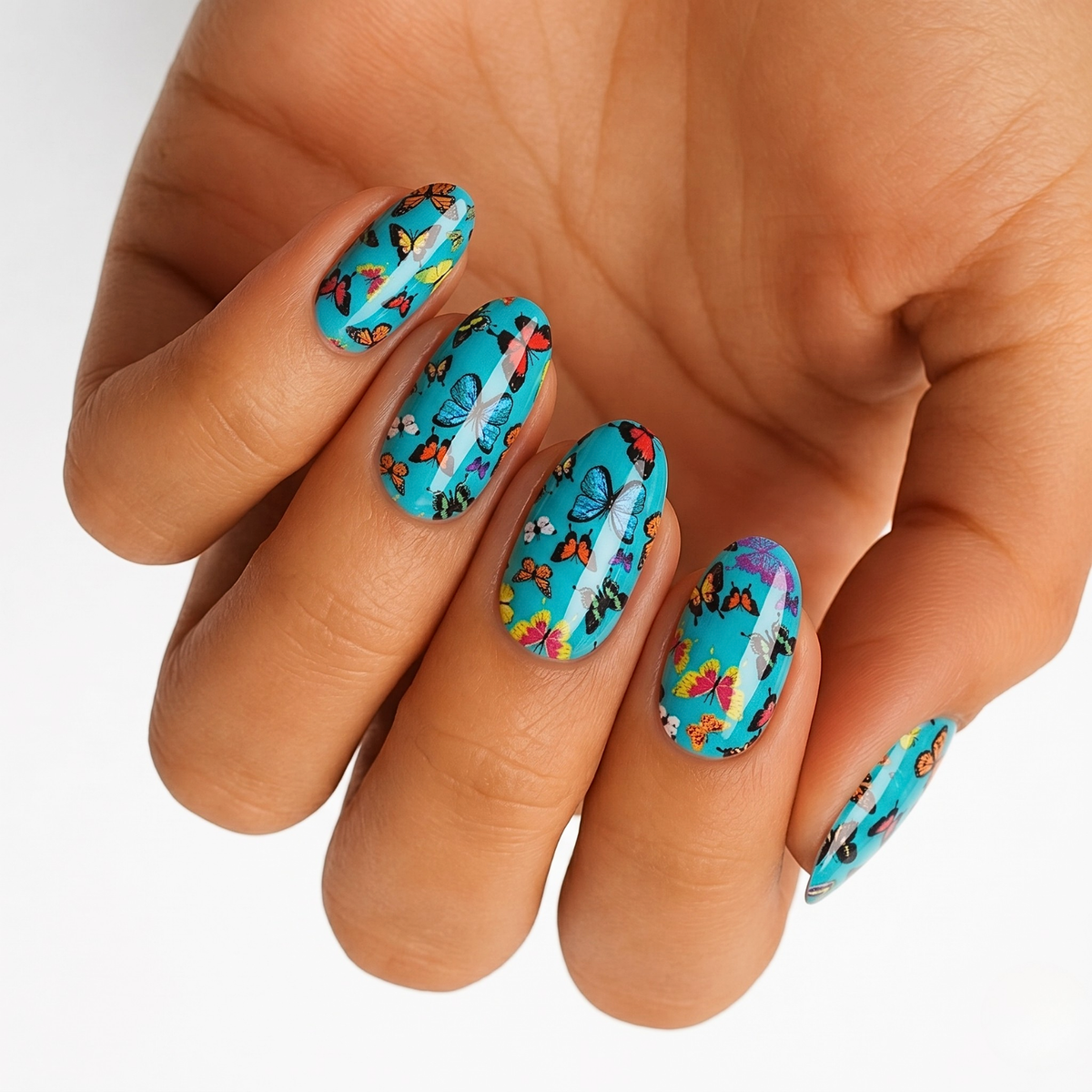 Turquoise nail wraps with colourful multicoloured butterfly print, glossy finish, almond shape