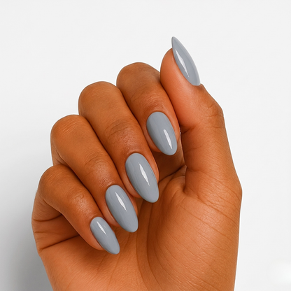 Solid slate grey glossy semi-cured gel nail wraps on almond-shaped nails.