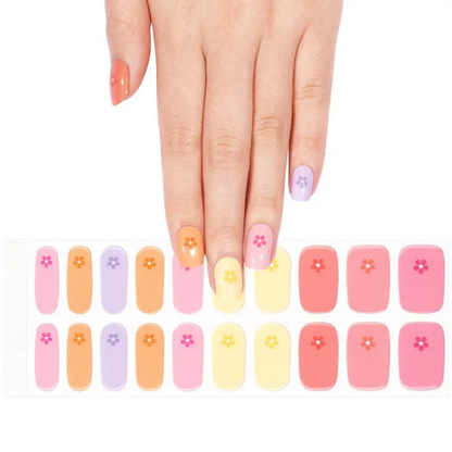 Semi-cured gel nail wraps in mixed pastel colours with small daisy flower accents
