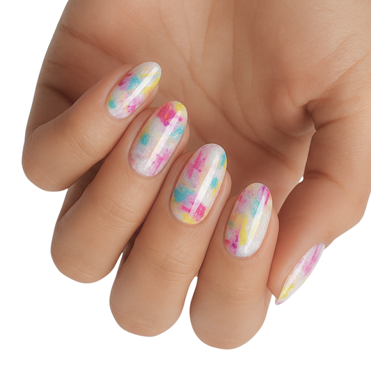 Non-UV nail wraps with shimmery white base and pink, blue, yellow tie-dye patches