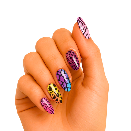 Nail wraps with mixed animal prints: pink zebra, leopard, blue giraffe, yellow cheetah patterns.