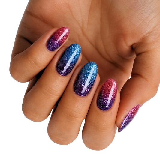Glitter nail wraps with pink-purple and blue-purple ombré on almond-shaped nails
