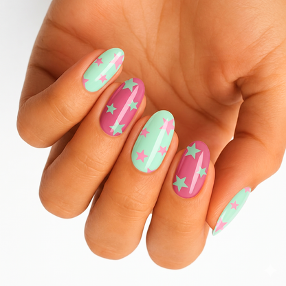 Glossy mint green and pink nail wraps with contrasting star pattern design
