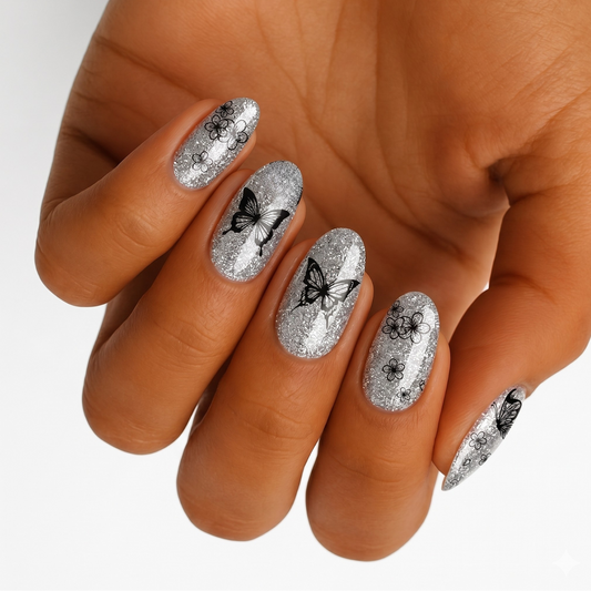 Silver glitter nail wraps with black butterfly and floral outline designs