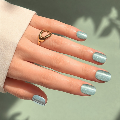 Sage-grey cat's eye shimmer soft gel press-on nails, extra short natural round shape.