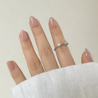 Extra short natural almond soft gel press-ons in a glossy mauve-pink shade