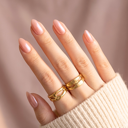 Glossy nude-pink soft gel press-ons with glazed finish, extra short almond shape.