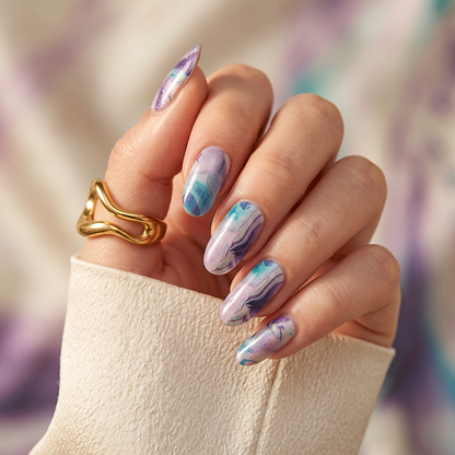 Almond nail wraps with purple and teal marbled ink-swirl design on shimmer base