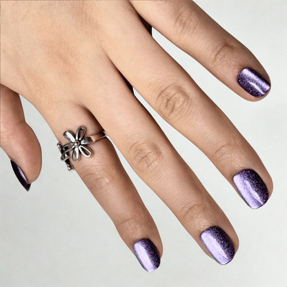 Extra short natural-shaped soft gel press-ons in shimmering purple cat's eye finish