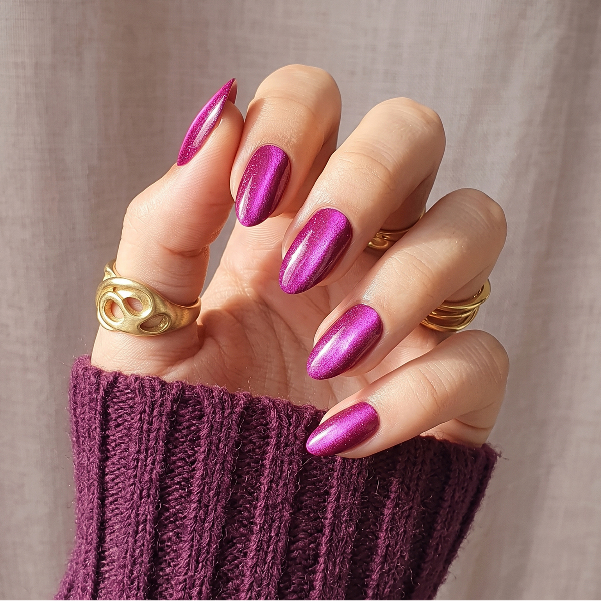 Magenta-berry cat's eye soft gel press-on nails with shimmering metallic finish, short almond shape