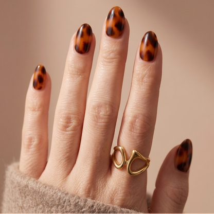 Soft gel press-on nails in glossy amber tortoiseshell print, XS almond shape