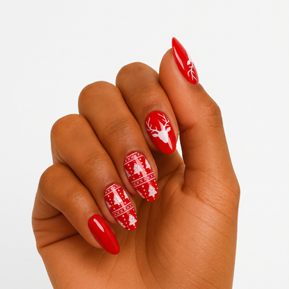 Red glossy semi-cured gel wraps with white reindeer, snowflake and Christmas jumper patterns