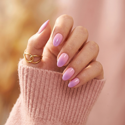 Soft gel press-on nails in pink-lilac shimmer with pearlescent sheen, almond shape