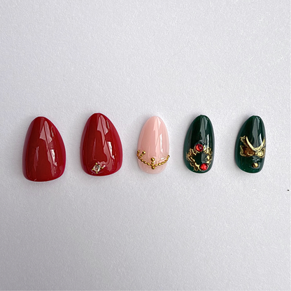 Sleigh Queen press-on nails: red, nude and green glossy glam with gold charms and gems