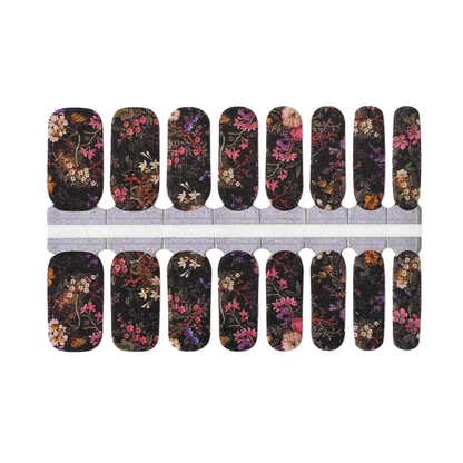 Black nail wraps with vintage floral print in pink, orange, and purple blossoms