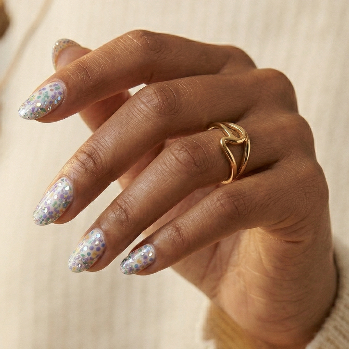Sheer nail wraps with pastel confetti dots and silver glitter, almond shape