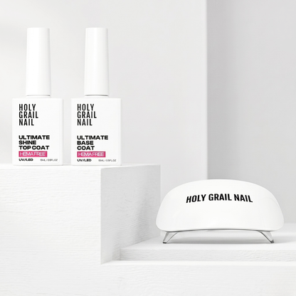 Holy Grail Nail UV/LED gel top and base coat bottles with white nail lamp