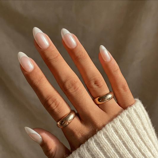 Short almond soft gel press-on nails with sheer pearl-white French tips