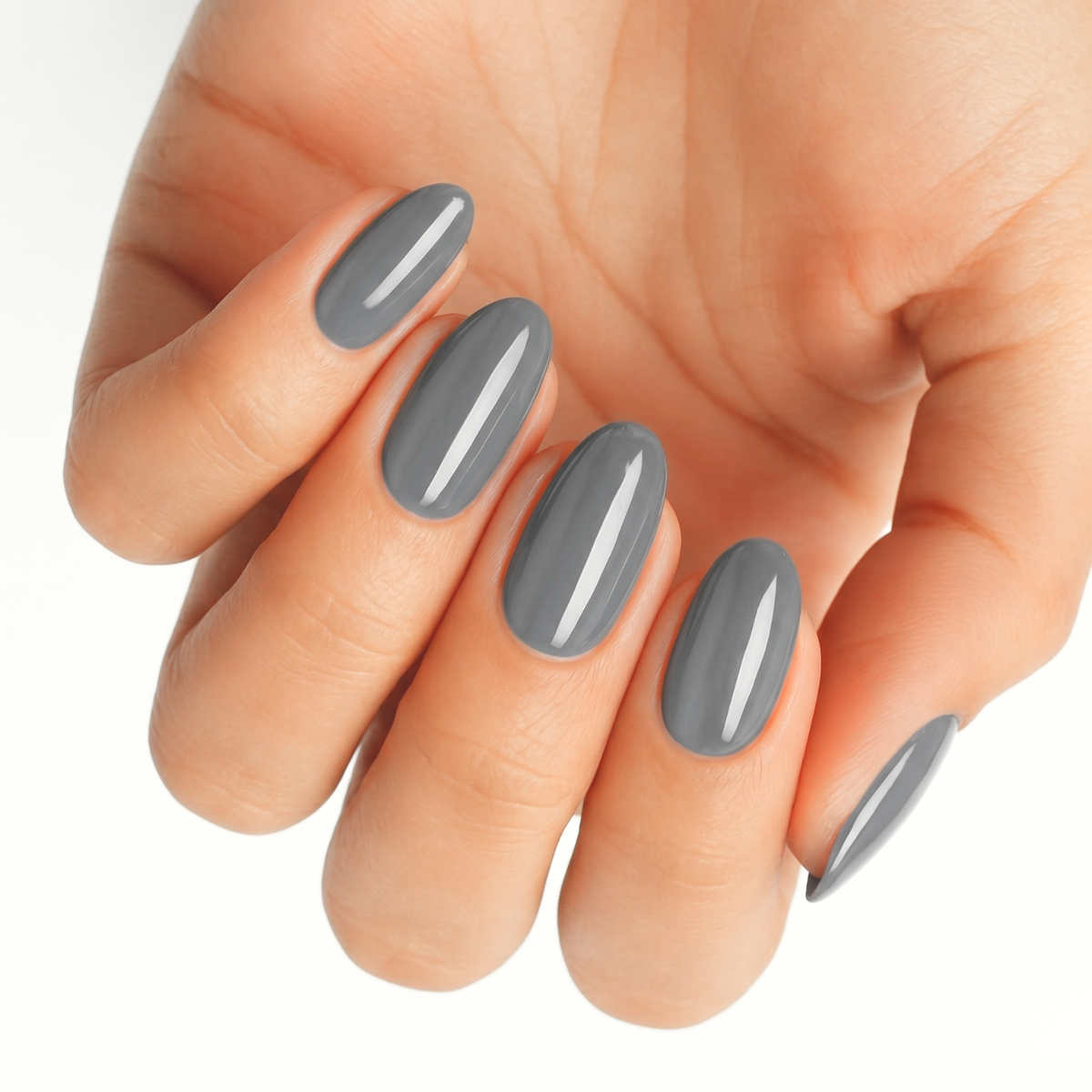 Solid grey glossy nail wraps on an oval manicure, high-shine finish.