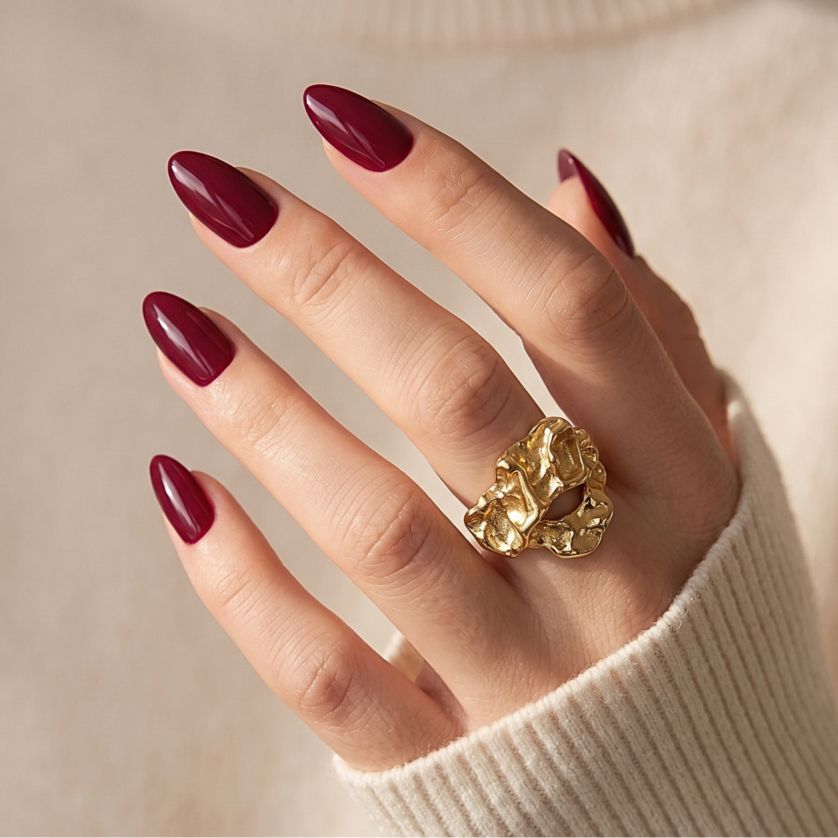 Dark burgundy glossy press-on nails in short almond shape, high-shine finish.